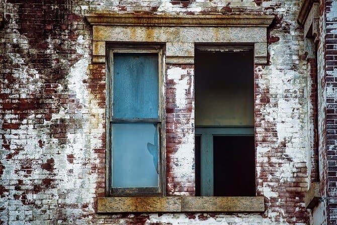Derelict building with a missing window