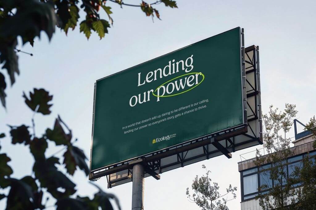 A billboard advert with Ecology's new brand, which says 'Lending our power. In a world that doesn't add up, daring to be different is our calling, lending our power so everyone's story gets a chance to thrive.'